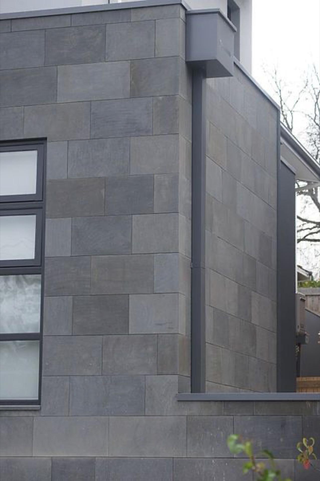 Dry cladding system being installed on a building